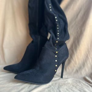 Woman over the knee black high boots, with some gold bolts. Sizes 7 1/2